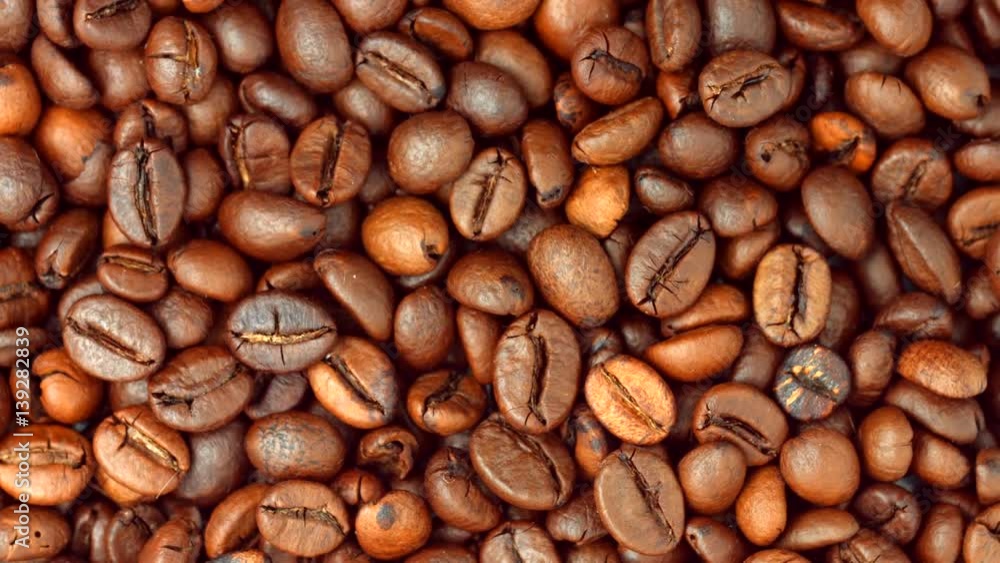 Coffee beans rotating background. Roasted coffee closeup Coffee beans rotating background. Roasted coffee closeup