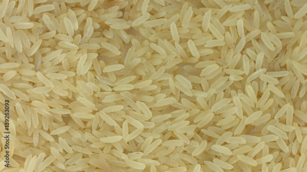 Rice background, closeup raw rice rotation. 4K video footage. Ultra HD 3840X2160 Rice background, closeup raw rice rotation. 4K video footage. Ultra HD 3840X2160