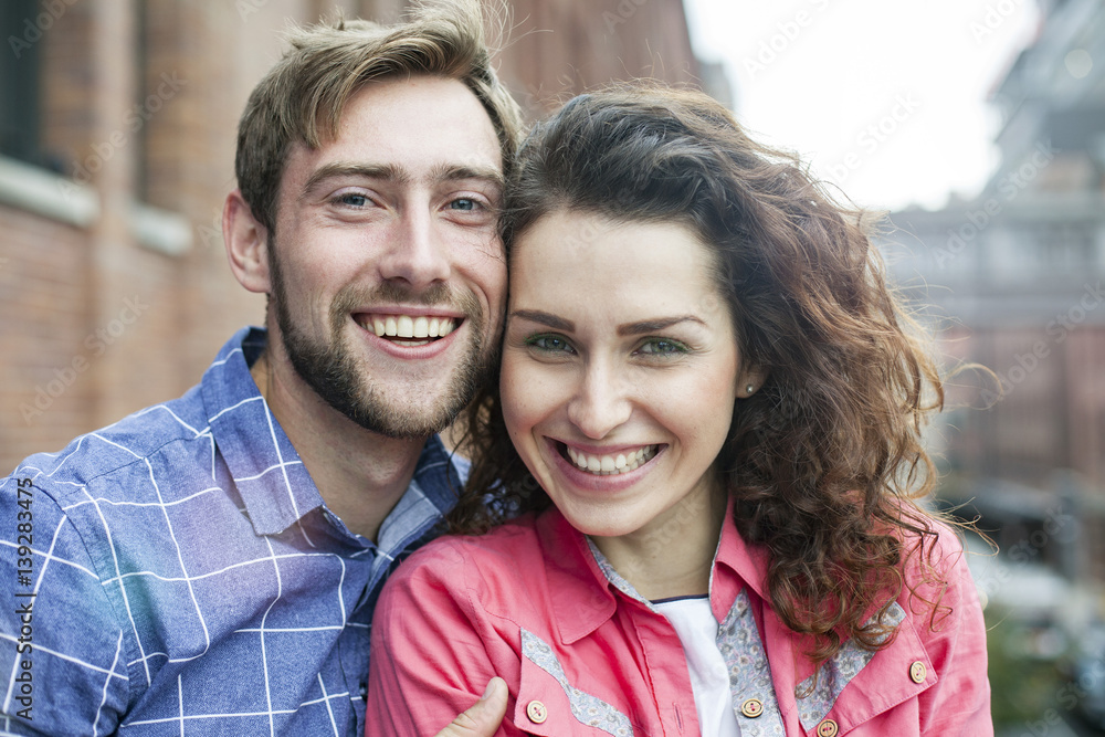 Couple smiling, cheek to cheek, portrait Couple smiling, cheek to cheek, portrait