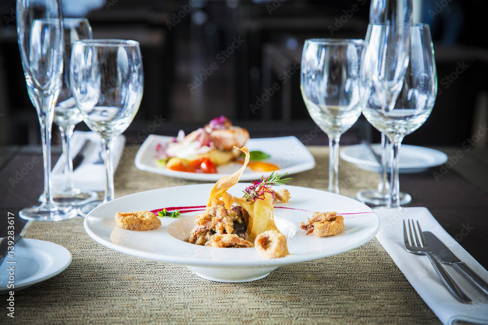 Gourmet seafood dish served into a bowl in restaurant