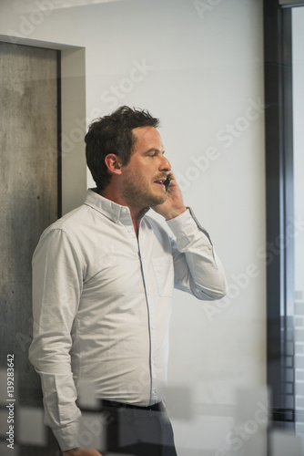 Man using office telephone
