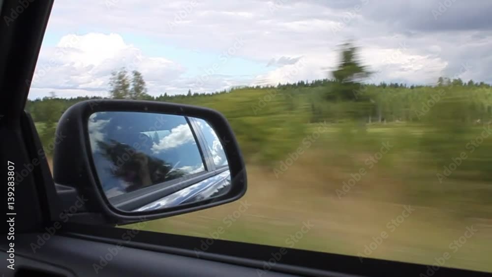 Rear view mirror of the car at the summer day Rear view mirror of the car at the summer day