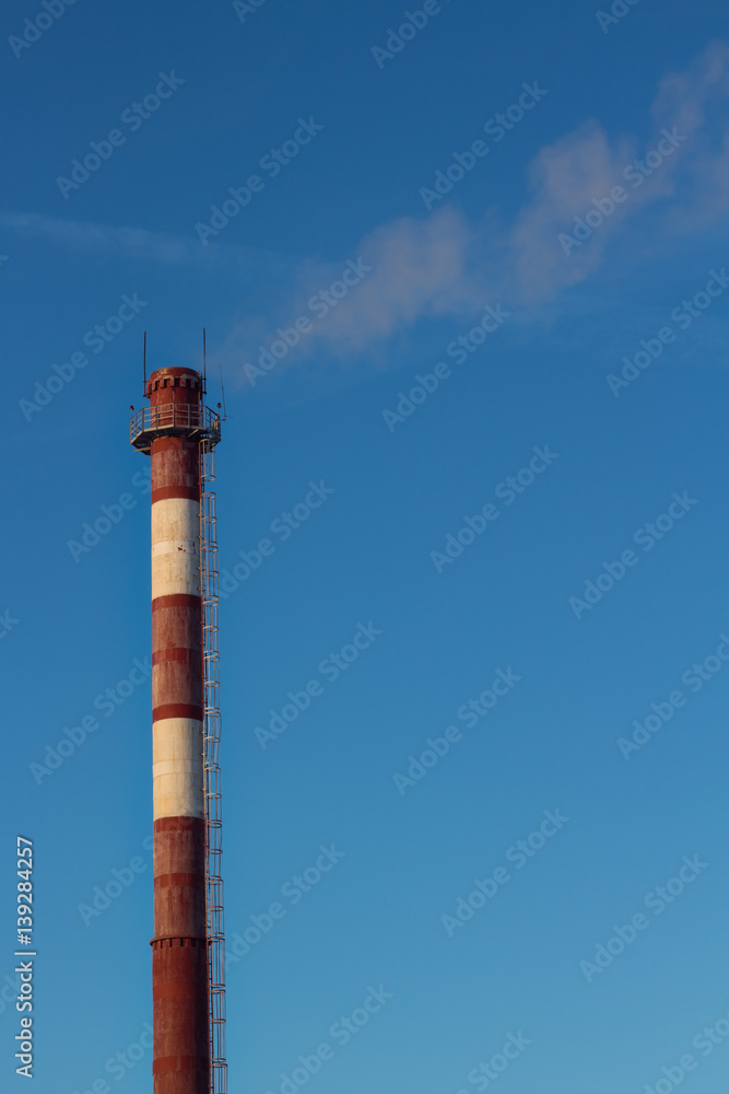 Steam escaping from pipe on the sky background at sunset, industrial emissions. Steam escaping from pipe on the sky background at sunset, industrial emissions.