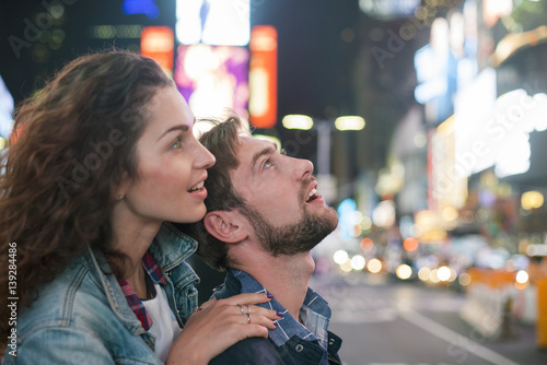 Young couple sightseeing in Times Square, New York City, New York, USA