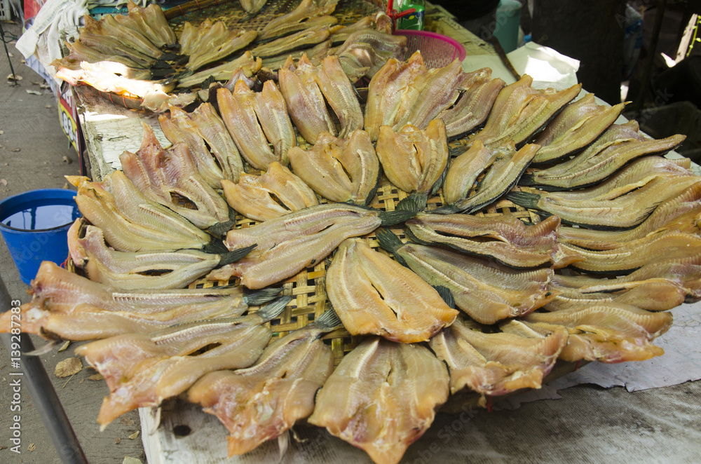 Dried raw fish or snakehead fish preserves for sale people at local shop