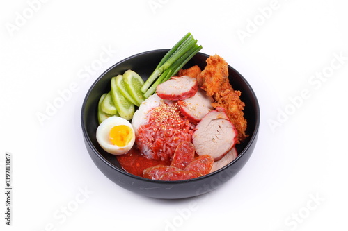 Jasmine rice with meat and boiled egg topped red sweet sauce .