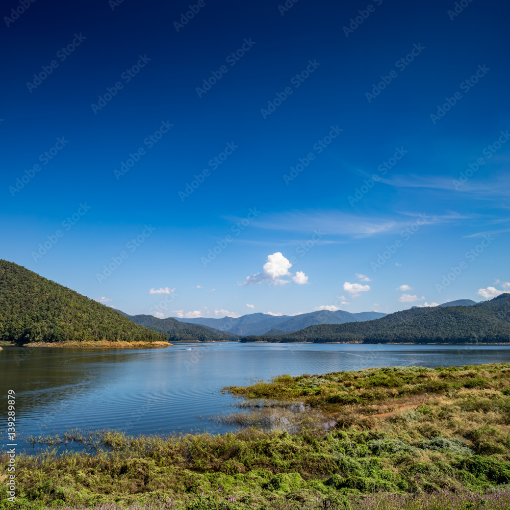 Lake with mountain and blue sky background Lake with mountain and blue sky background