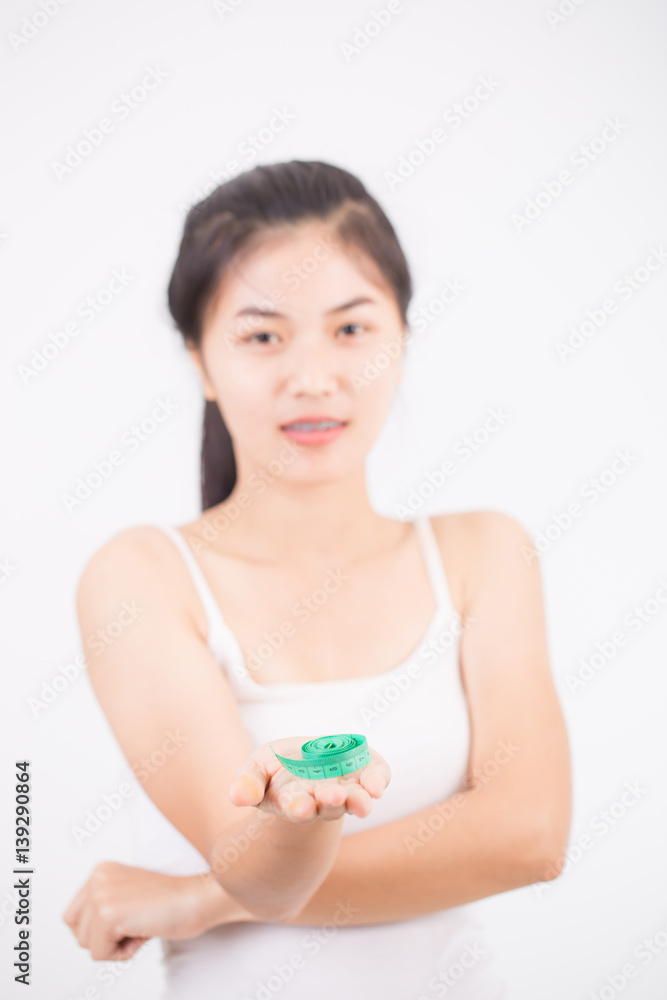 sport and heath concept - beautiful sporty woman with measuring tape sport and heath concept - beautiful sporty woman with measuring tape