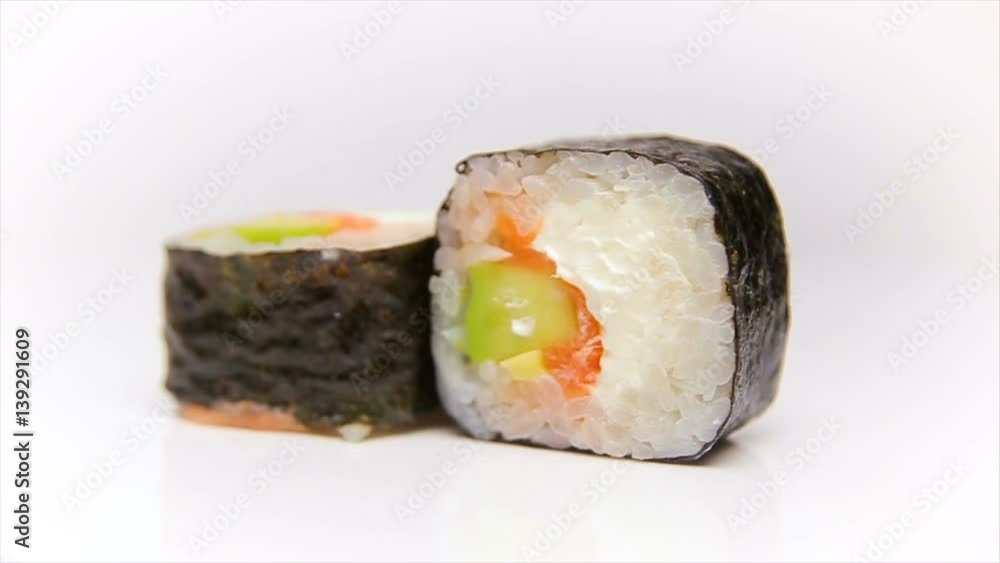 Syake avocado maki - Sushi roll with salmon, avocado and cheese rotating over white background, loop ready Syake avocado maki - Sushi roll with salmon, avocado and cheese rotating over white background, loop ready