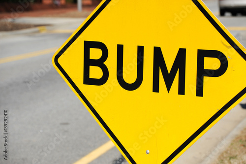close up on bump sign at the side of street photo