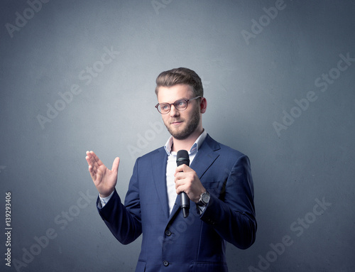 Businessman holding microphone