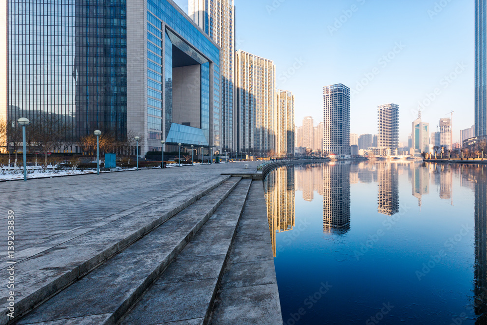 Obraz premium River And Modern Buildings Against Sky in Tianjin,China.