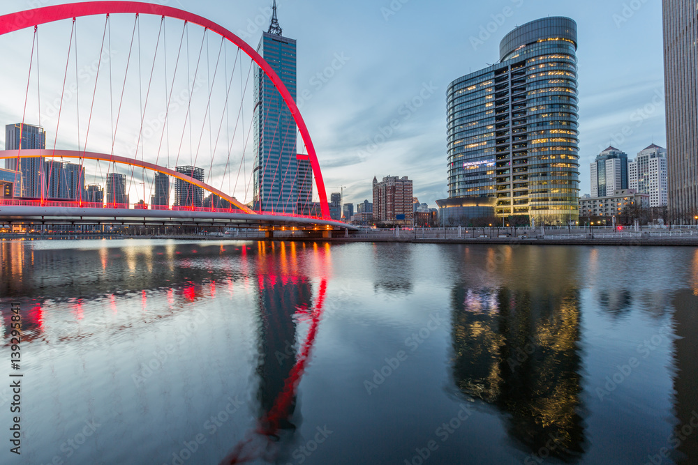 Naklejka premium River And Modern Buildings Against Sky in Tianjin,China.