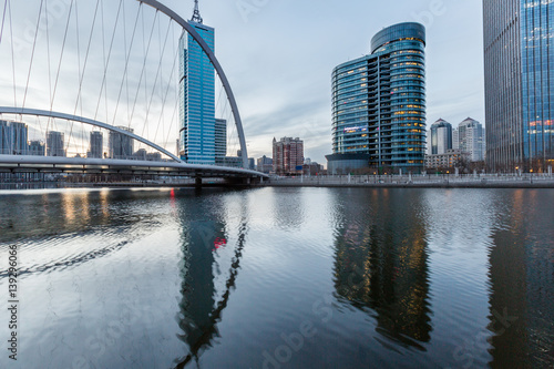 River And Modern Buildings Against Sky in Tianjin,China. © fanjianhua