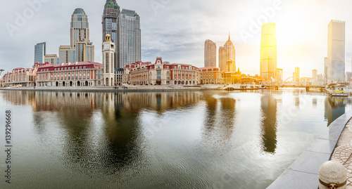 River And Modern Buildings Against Sky in Tianjin,China. © fanjianhua