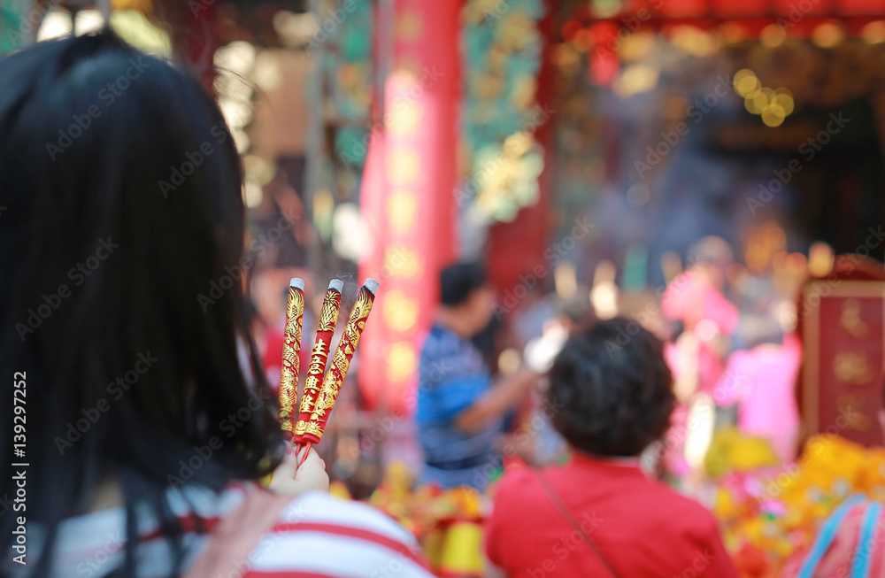 People pray respect with Incense burning for god in Chinese New Year day. Which is the cultural beliefs of the Chinese people at chinese temple in bangkok, Thailand.