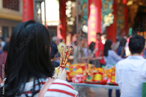 People pray respect with Incense burning for god in Chinese New Year day at chinese temple in bangkok, Thailand.