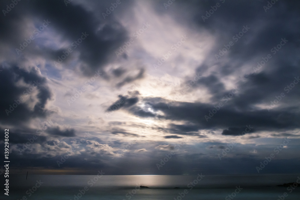 Fototapeta premium Moon rising over the sea