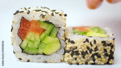 Chef serving luxury sushi rolls in japanese hotel restaurant Goma Maki photo