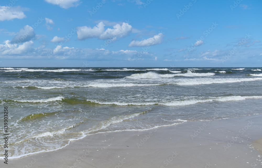Baltic Sea - water waves. Beautiful blue sky and turbulent sea. 