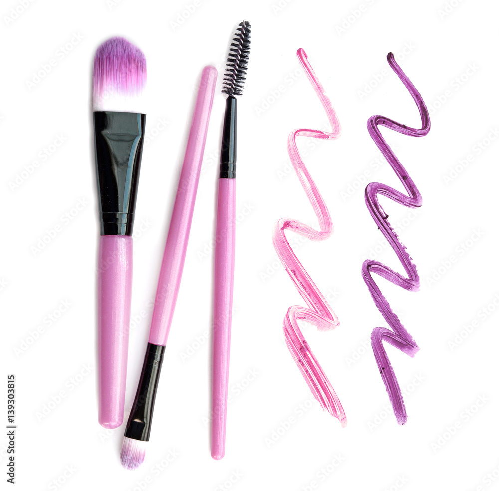 Set of make-up brushes with lipstick trace isolated on white background. Set of make-up brushes with lipstick trace isolated on white background.