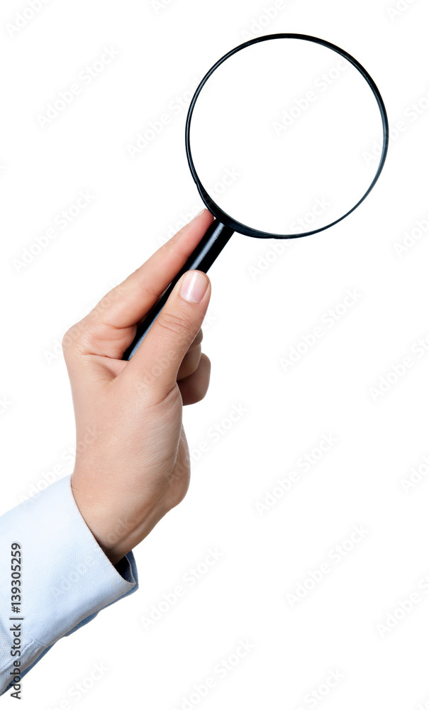 Female hand holding the magnifying glass isolated on white background Female hand holding the magnifying glass isolated on white background