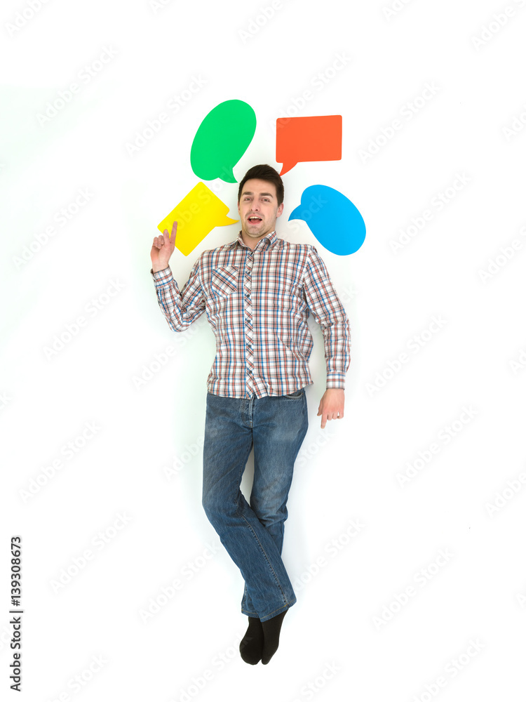 The man lay and gesture near the dialog signs. View from above The man lay and gesture near the dialog signs. View from above