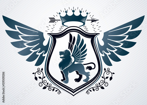 Vector retro insignia design decorated using vintage elements like monarch crown, eagle wings and wild lion illustration