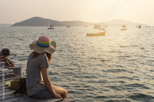 Young women traveller looking at the sea