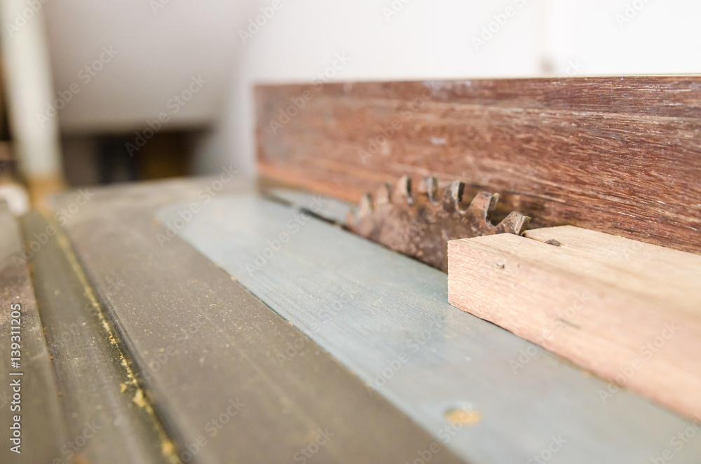 The carpenter was working furniture wood in studio , Soft-focus image The carpenter was working furniture wood in studio , Soft-focus image