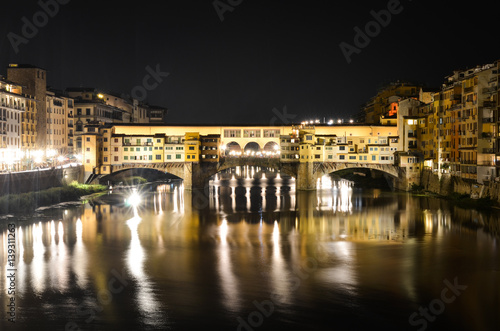 Night bridge Ponte Vecchio over Arno river in Florence