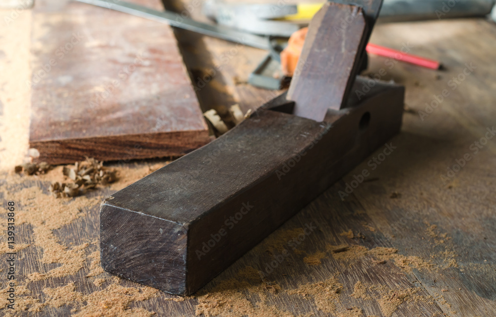 The carpenter was working furniture wood in studio , Soft-focus image The carpenter was working furniture wood in studio , Soft-focus image