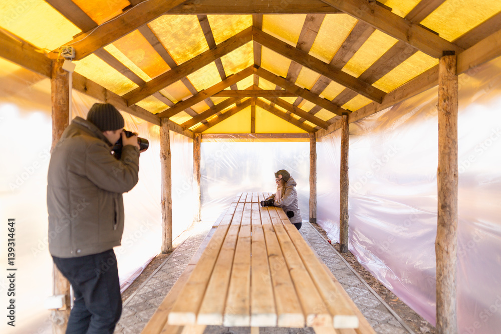 male photographer with the camera on nature.