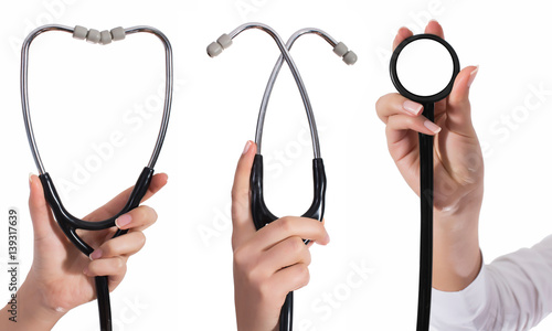 Doctor's hands holding stethoscope.Studio shot isolated on white