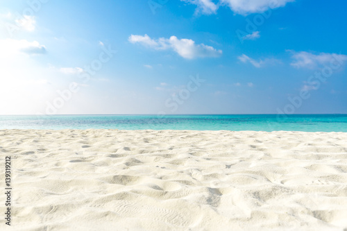 Sea view from tropical beach with sunny sky. Summer paradise beach website design. Tropical shore. Tropical sea in Maldives. Exotic summer beach sky clouds on horizon. Ocean beach relax outdoor travel