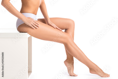 Female legs on white background