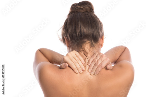 Woman with pain in her back and neck photo