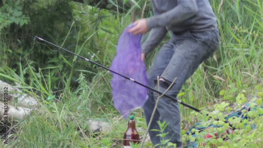 poacher spring/One poacher in spring fishing in lake poacher spring/One poacher in spring fishing in lake