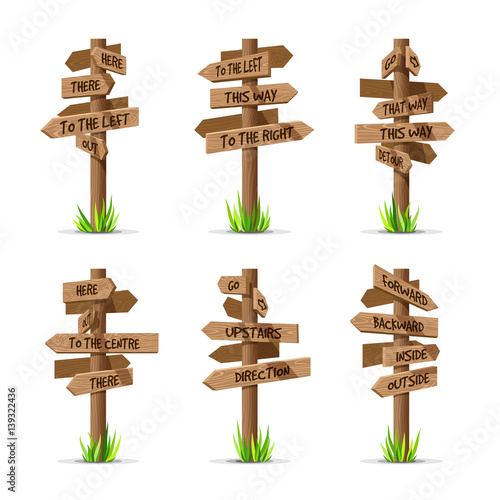 Wooden arrow signboards direction vector set. Wood sign post concept with grass. Board pointer illustration with text isolated on a white background