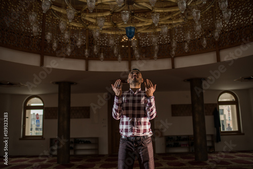 Muslim praying with open palms