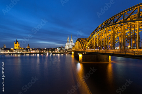 Illuminated Cologne Cathedral and Hohenzollern-Bridge/Germany