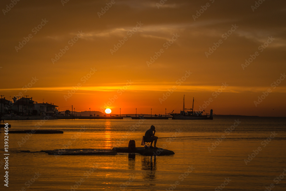 Fishing at sunset over Pefkohorija