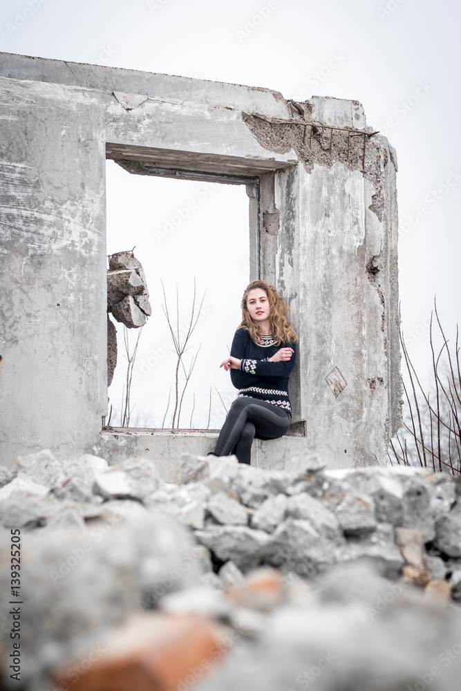 Seated girl on the ruins