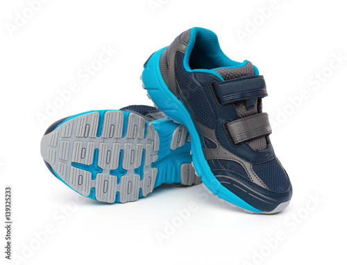 pair of blue and black sporty shoes for kid on white background