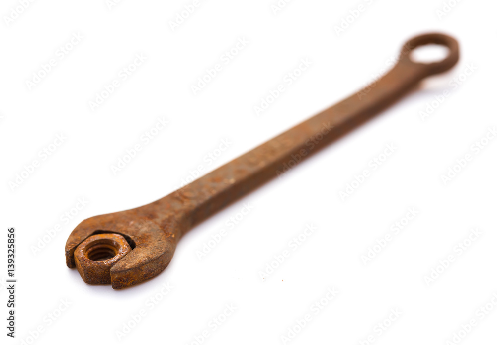 rusty nut and spanner on a white background rusty nut and spanner on a white background