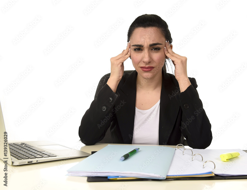 business woman working on laptop at office in stress suffering intense headache migraine business woman working on laptop at office in stress suffering intense headache migraine