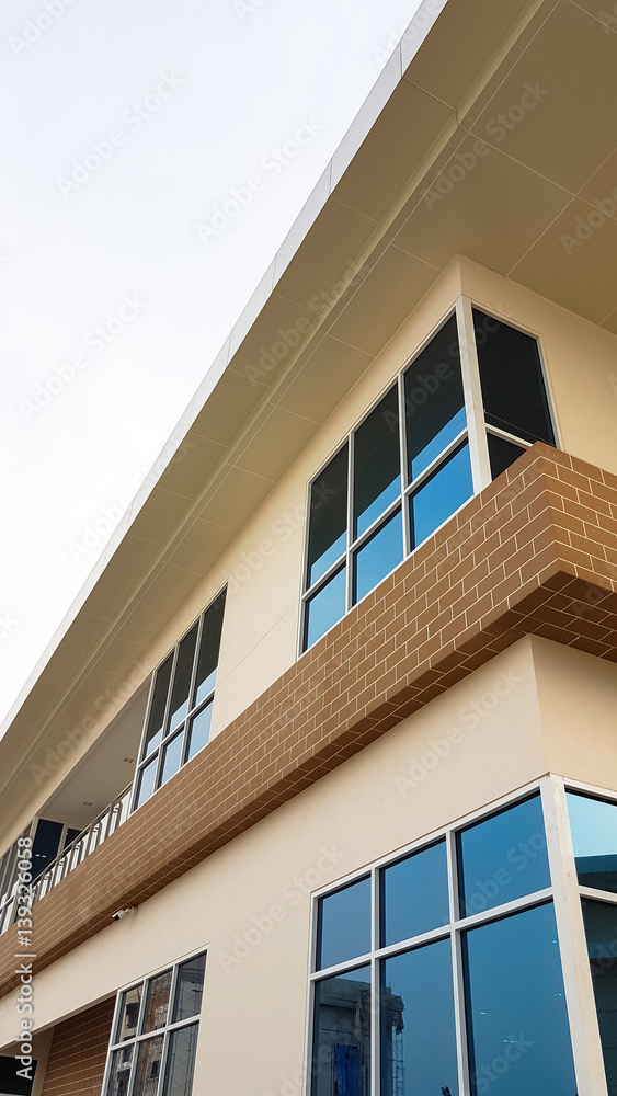 beautiful concrete building with long mirror , decorate with brown brick