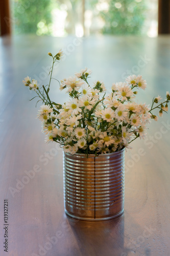 Fototapeta Naklejka Na Ścianę i Meble -  Vintage white flower pot on wooden table
