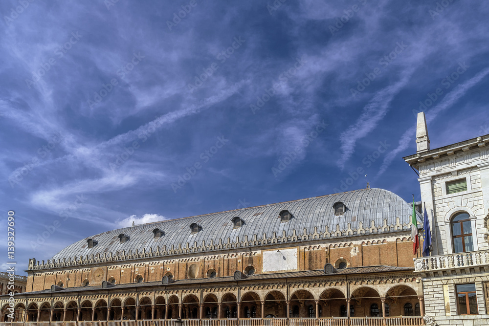 The famous Palazzo della Ragione palace in Piazza delle Erbe in Padua, Italy, against a beautiful sky