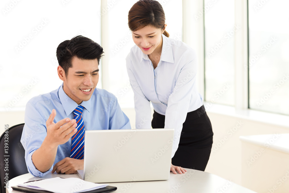 Business people discussing the plan in office Business people discussing the plan in office
